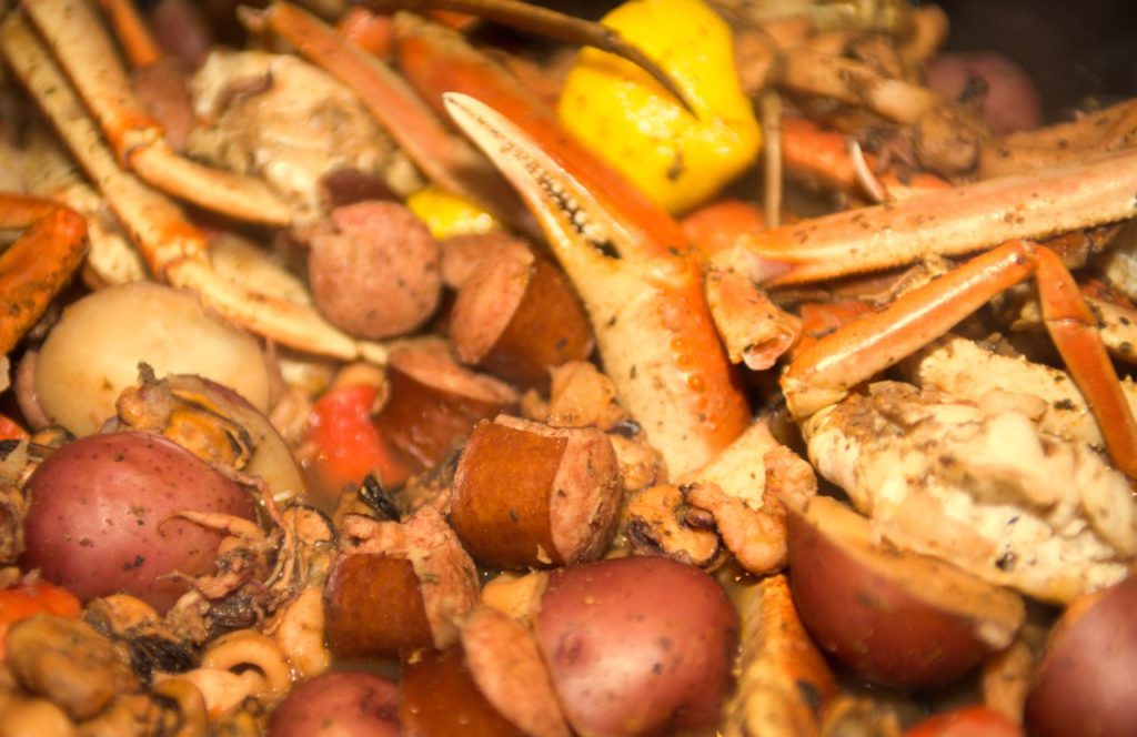 Seafood boil with crab legs, potatoes and sausage. Keep reading to learn more about fun things to do for Memorial Day Weekend in Florida. 